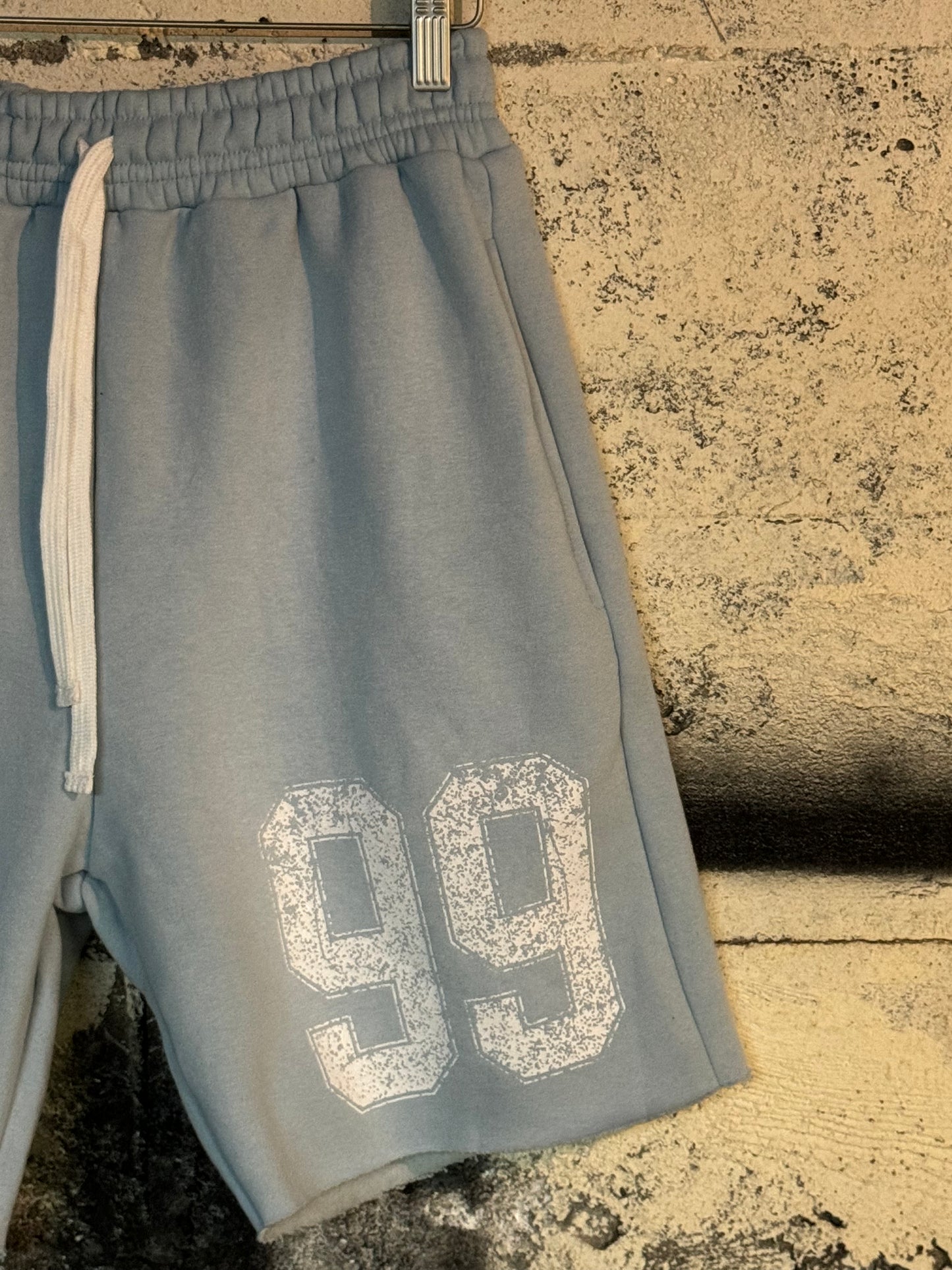 DISTRESSED 99 SWEAT SHORTS